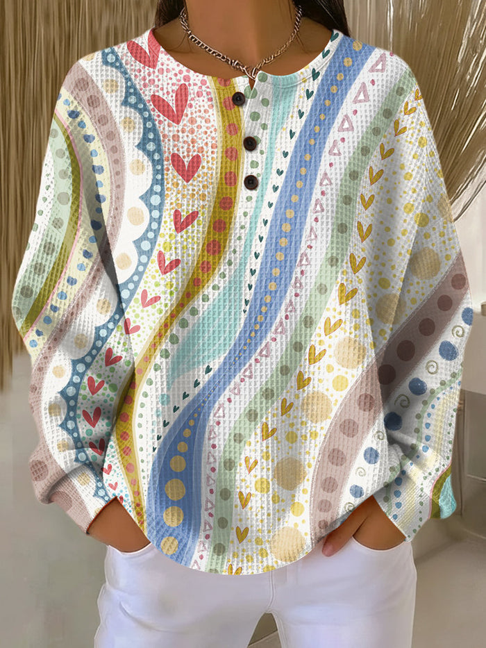 Women's colorful striped waffle-knit sweater with relaxed fit and soft brushed lining