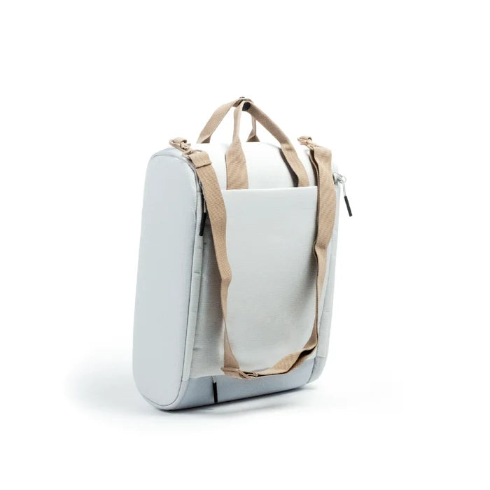A light gray soft-sided CPAP insert with beige webbed handles and straps, shown on a clean white background.