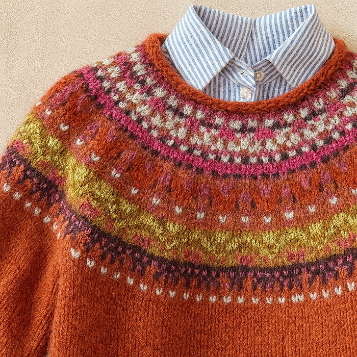 Red vintage Nordic knit sweater with classic patterned design and relaxed fit