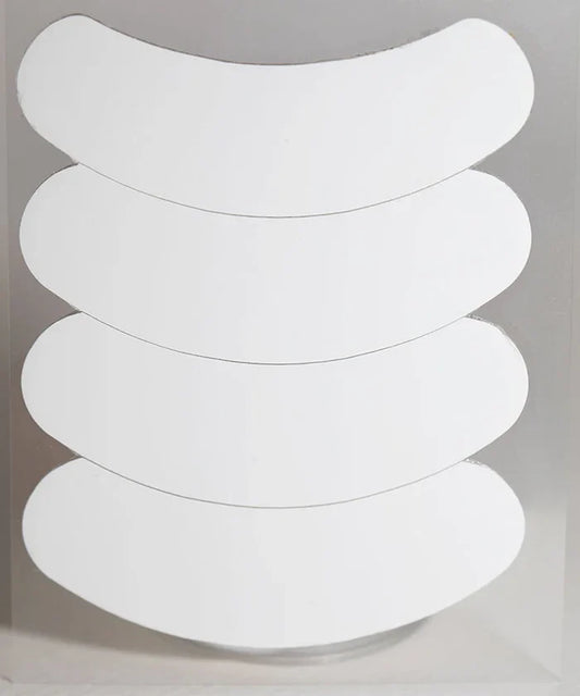 White oval-shaped 3d silicone gel eye patches stacked for lash technicians using gel eye patch treatment
