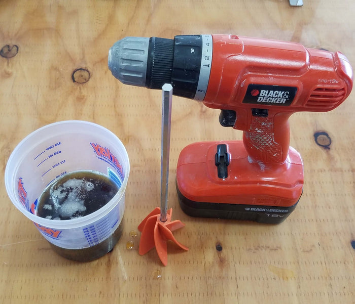 2lb Polyurethane Pour Foam in Mixing/Measuring Cup Ready to be Mixed