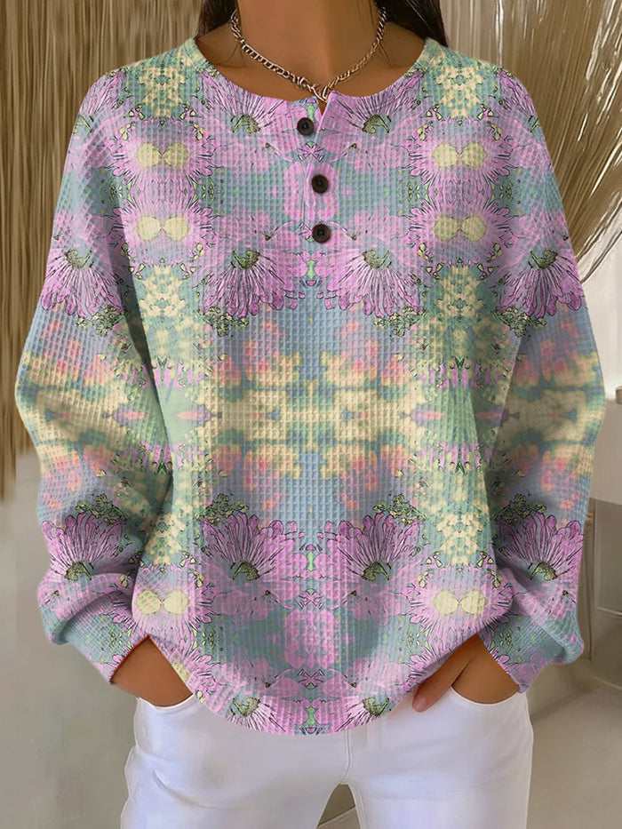 Light pink waffle-knit sweater with ethnic floral pattern and relaxed fit