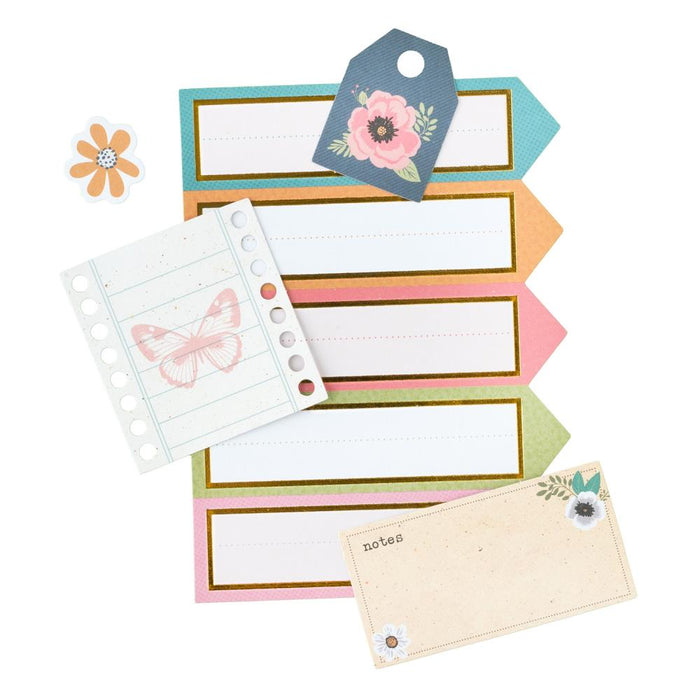 American Crafts -  Ephemera Die-Cuts 66/Pkg - Journaling, Gold Foil - April And Ivy. Introducing April and Ivy by American Crafts- a paper collection that effortlessly combines vintage allure, eclectic flair, and vibrant energy. Available at Embellish Away located in Bowmanville Ontario Canada.
