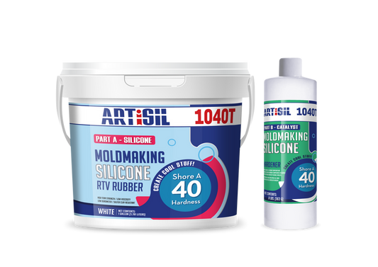 Gallon white plastic tub of ArtiSil 1040T silicone mold making rubber with small bottle of hardener sitting next to it.