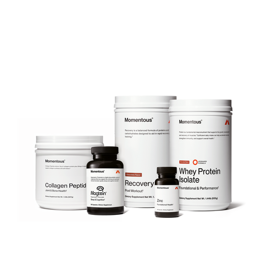 Five white and black Momentous supplement containers arranged in a row, including collagen peptide powder, magnesium capsules, recovery powder and zinc capsules.
