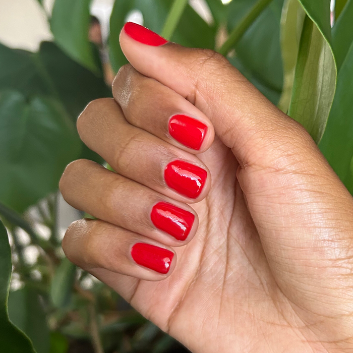 CV - Gel shown on short natural nails in a glossy cherry red for a vibrant and long-lasting manicure by Olive and June