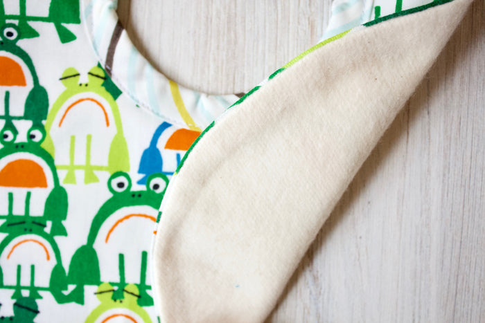 Bobby the Frog Bib-The Blue Peony-Animal_Frog,Category_Bib,Color_Blue,Color_Green,Department_Organic Baby,Material_Organic Cotton,Pattern_Ed Emberley's Animals,Theme_Animal