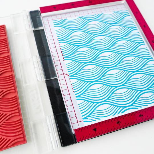 Catherine Pooler - Background Stamp - Making Waves. Create a funky background with the Making Waves Background Stamp. Grab your spa blues like Tranquil and Cove Blue for a natural effect or why not mix in bright and funky colors to add this wavy print to any festive card. This one will be fun for nautical cards and beyond! Available at Embellish Away located in Bowmanville Ontario Canada.