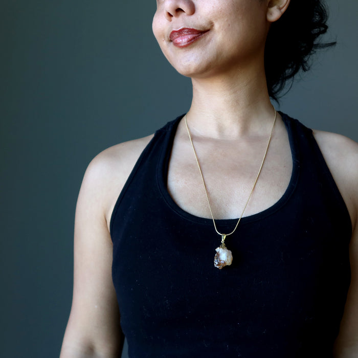 female wearing raw citrine necklace