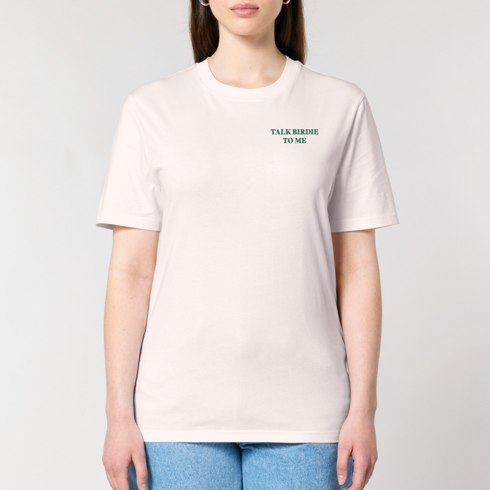 Person wearing a white t-shirt with text on a plain background