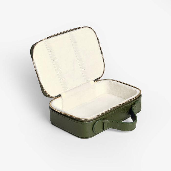 Green travel case with open lid on a white background