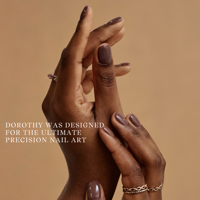 Close-up of hands with polished nails on a beige background with text about nail art.