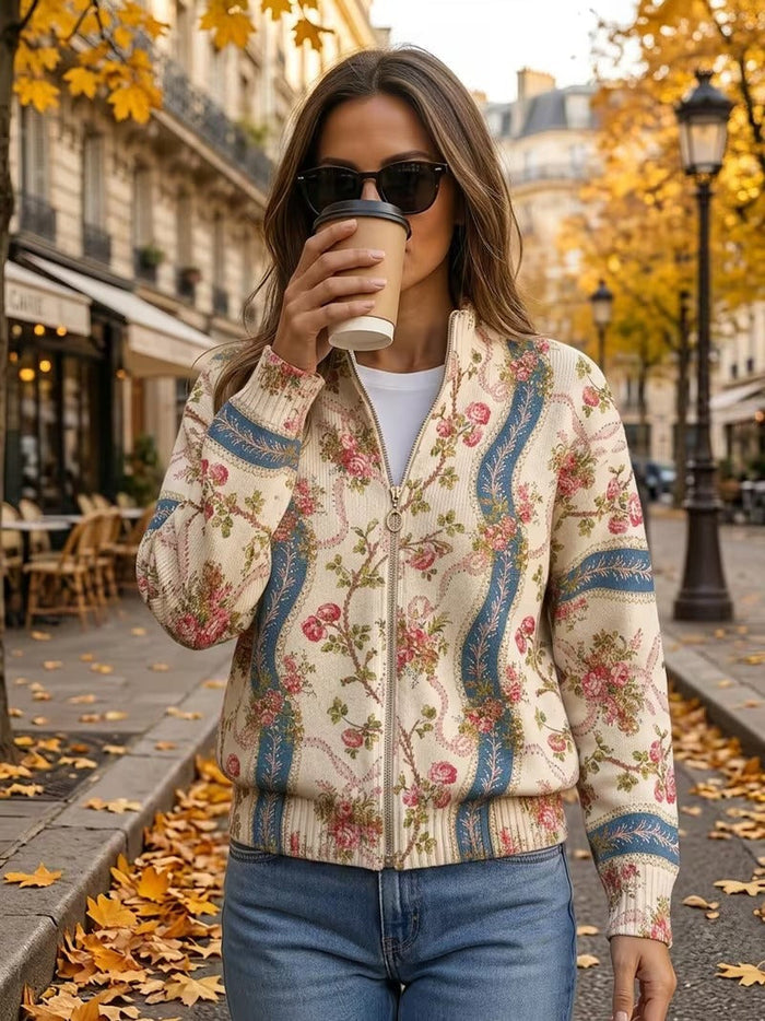Ivory zip-front cardigan with pink climbing rose print and blue ribbon bands, ribbed collar and cuffs