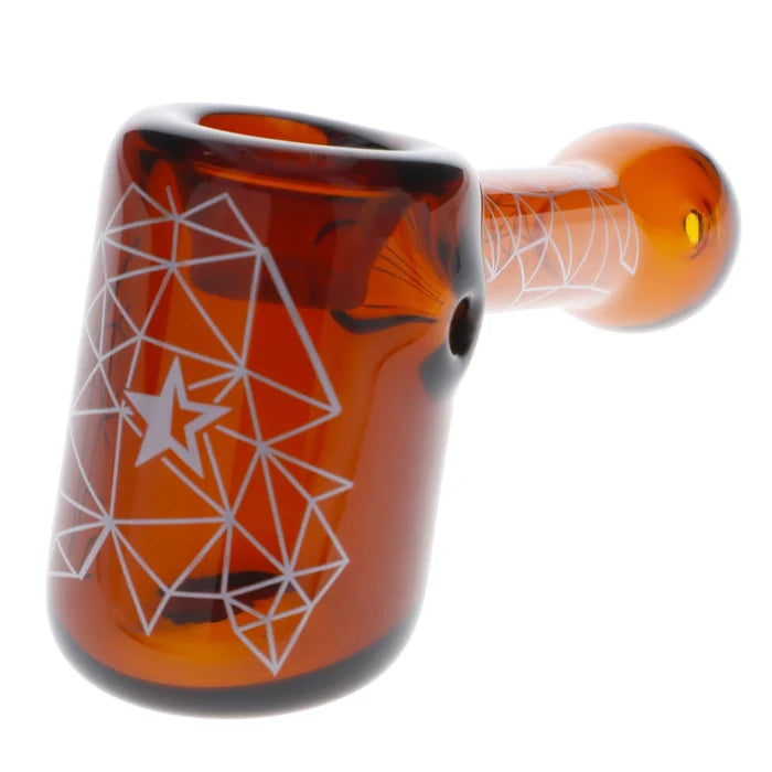 A front view of the 5-inch Famous Design Space Hammer Pipe in amber glass, featuring geometric designs.