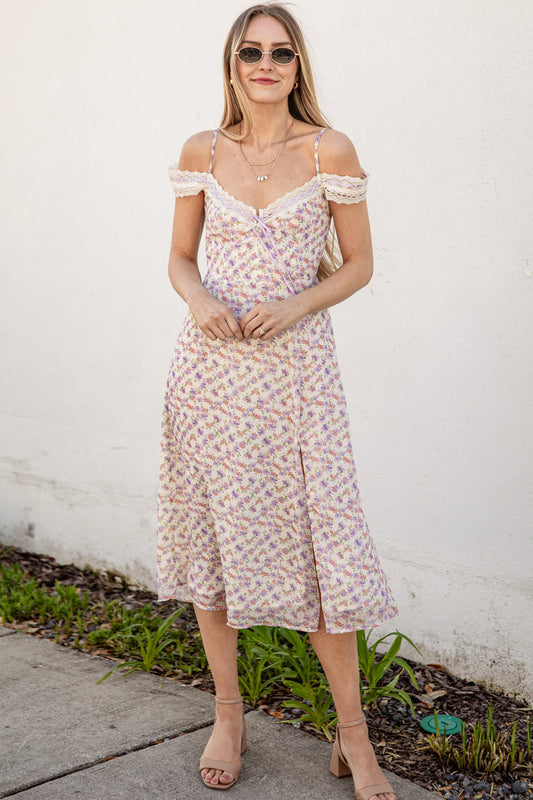 Floral dress with lace straps on a plain background