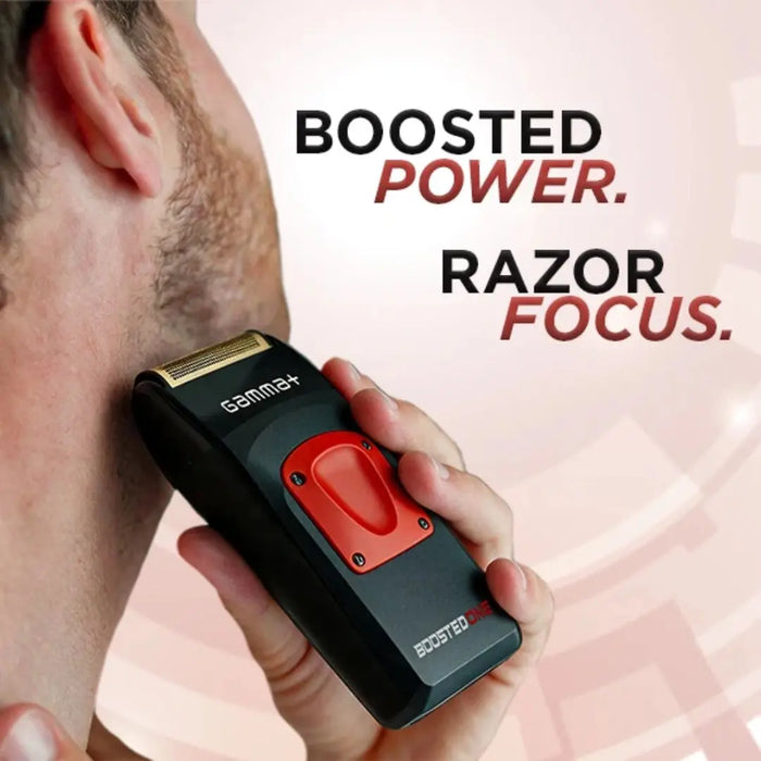 A close-up lifestyle shot of a man holding a black and red GammeF electric razor against his cheek, with promotional text reading 'BOOSTED POWER. RAZOR FOCUS.