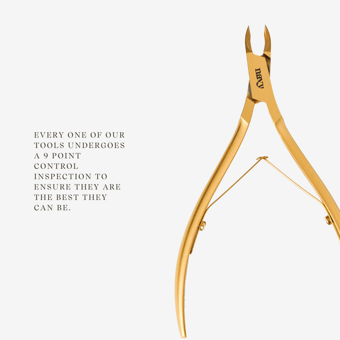 Gold nail clippers on a white background with text about inspection process.