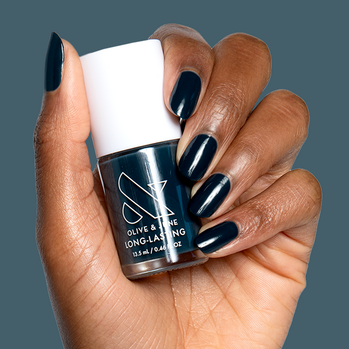 I'm Just Looking" ultra deep teal nail polish on natural nails for a sleek long-lasting mani by Olive and June