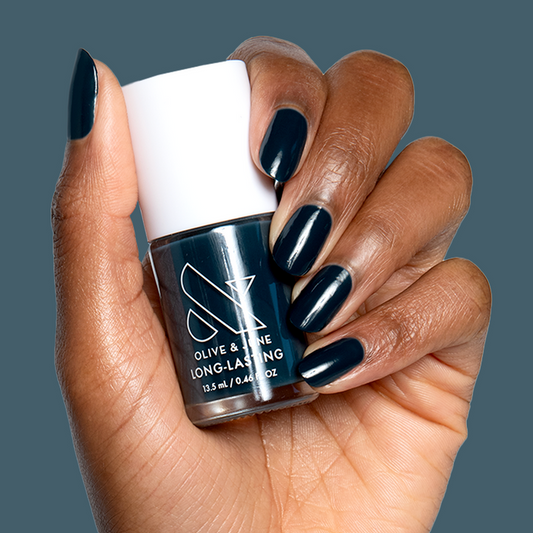 I'm Just Looking" ultra deep teal nail polish on natural nails for a sleek long-lasting mani by Olive and June