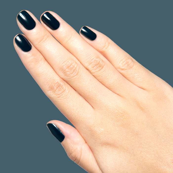 I'm Just Looking ultra deep teal gel polish on natural nails for a sleek manicure by Olive and June