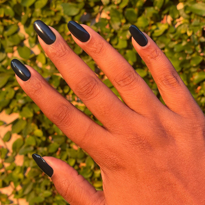 I'm Just Looking ultra deep teal gel polish on medium almond-shaped nails for a glossy manicure by Olive and June