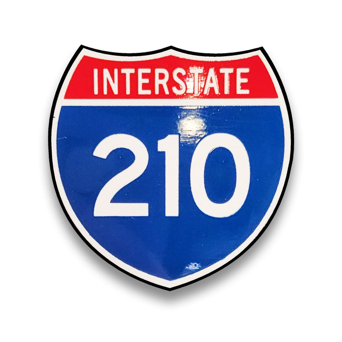 Interstate 210 sign with red top and blue bottom on a white background.