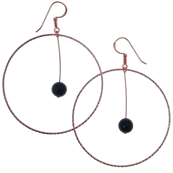 jet stones in big copper hoop earrings
