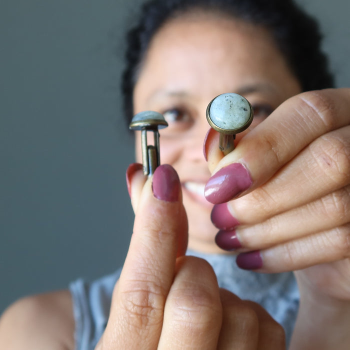 sheila of satin crystals holding labradorite cufflinks