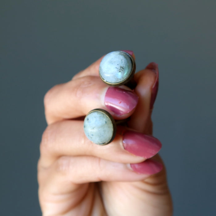 sheila of satin crystals holding labradorite cufflinks