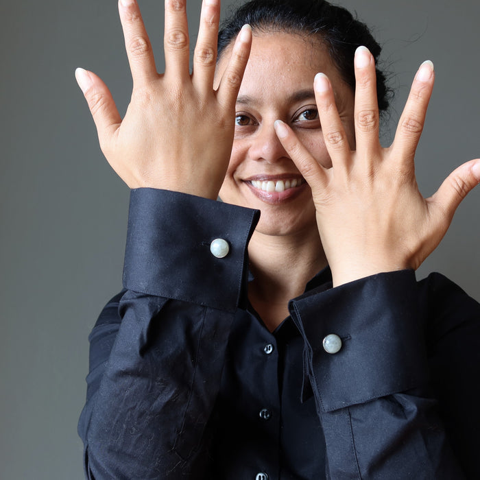 labradorite cufflinks on woman wearing black french cuff shirt