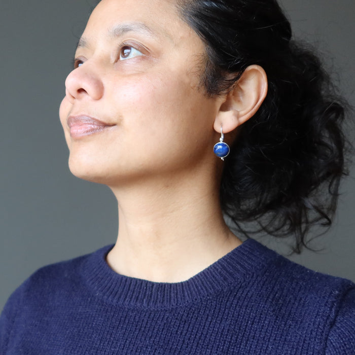 woman wearing lapis lazuli sterling silver earrings