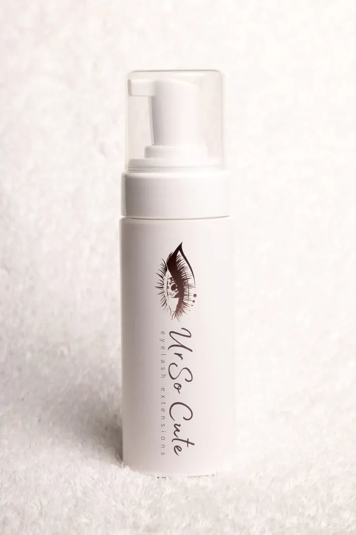 White cylindrical lash foam shampoo bottle with clear pump and black eyelash illustration foaming cleanser lash