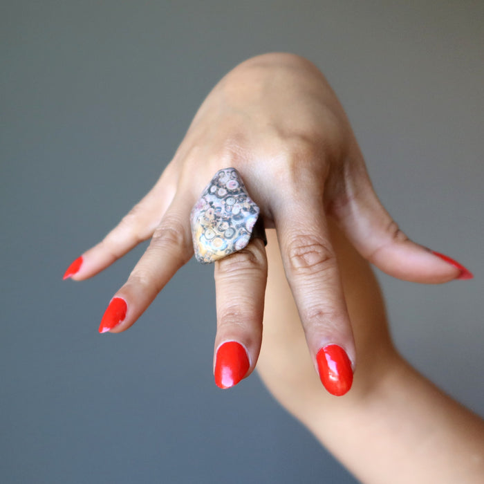 hand wearing leopard jasper ring