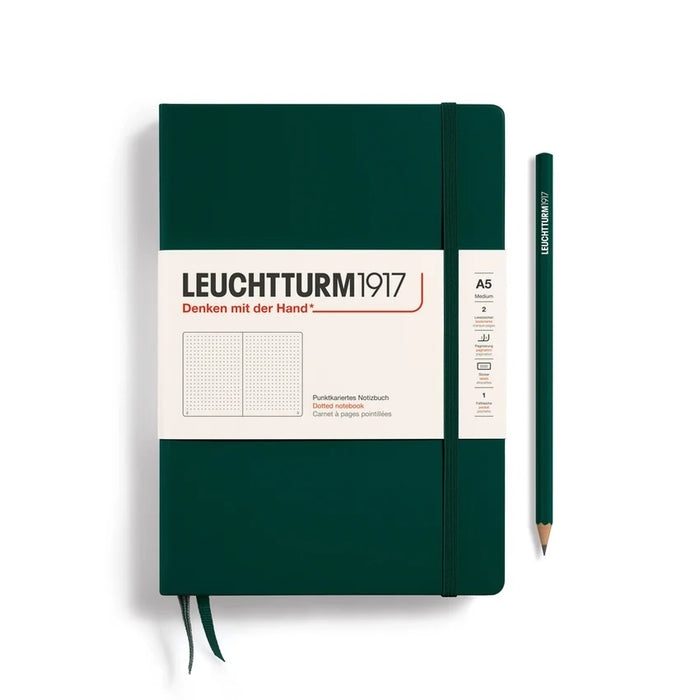 A Leuchtturm1917 A5 notebook in dark green with a white paper band around the middle, shown closed with a white background.