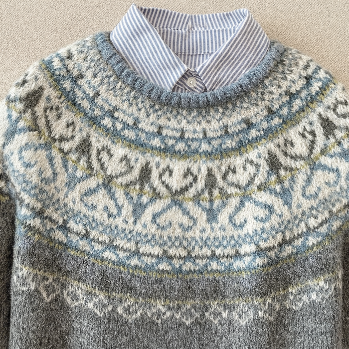 Grey vintage Nordic knit sweater with classic pattern and relaxed fit
