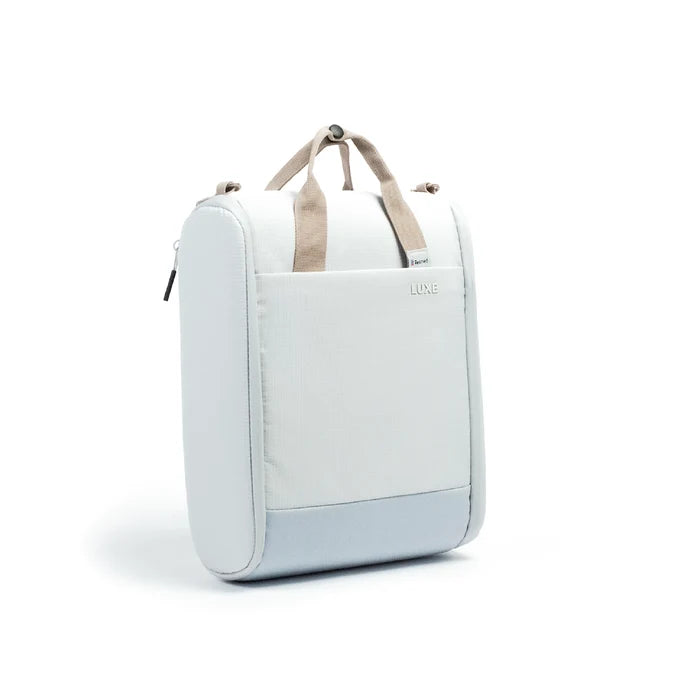 A light blue and white CPAP insert bag with beige handles, shown from a three-quarter angle on a white background.