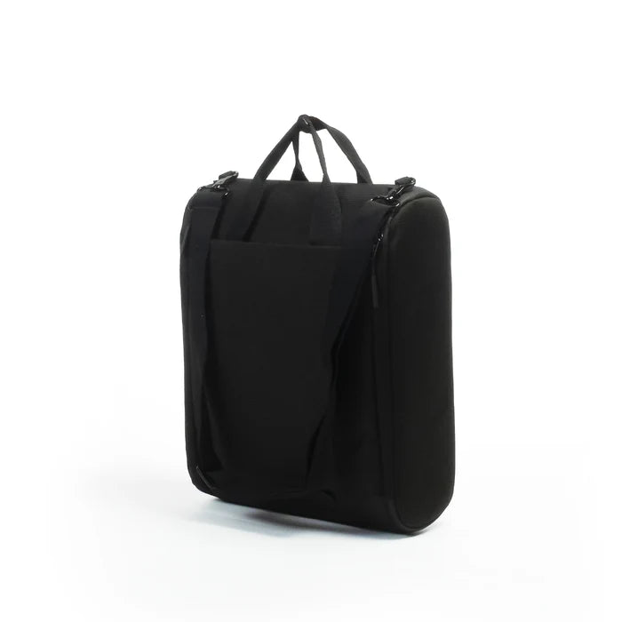 A black CPAP insert with dual top handles and a front slip pocket, photographed on a clean white studio background.