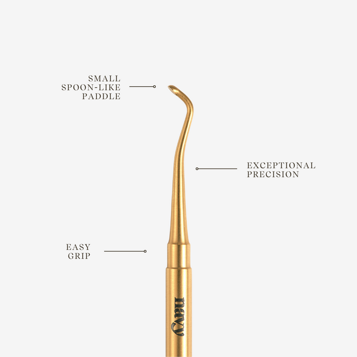 Gold manicure tool with labeled features on a white background
