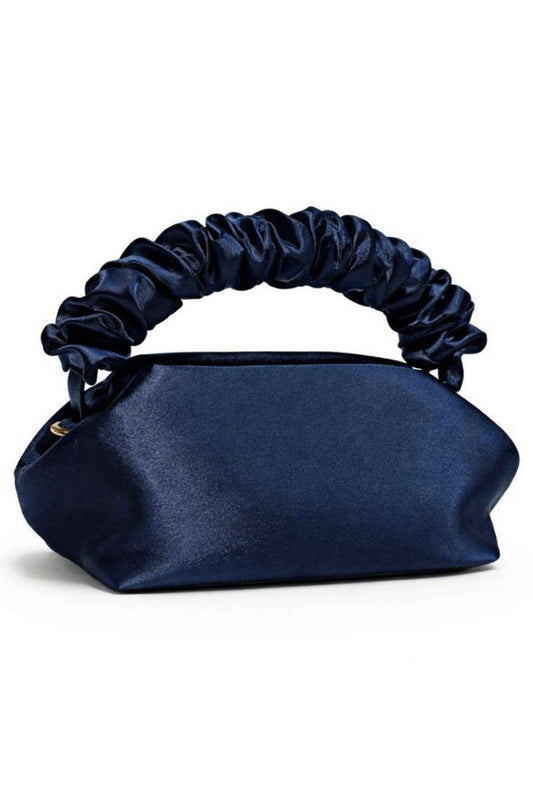 Navy blue satin clutch bag with a ruched handle, soft structured shape, and gold hardware detail, perfect for evening occasions.
