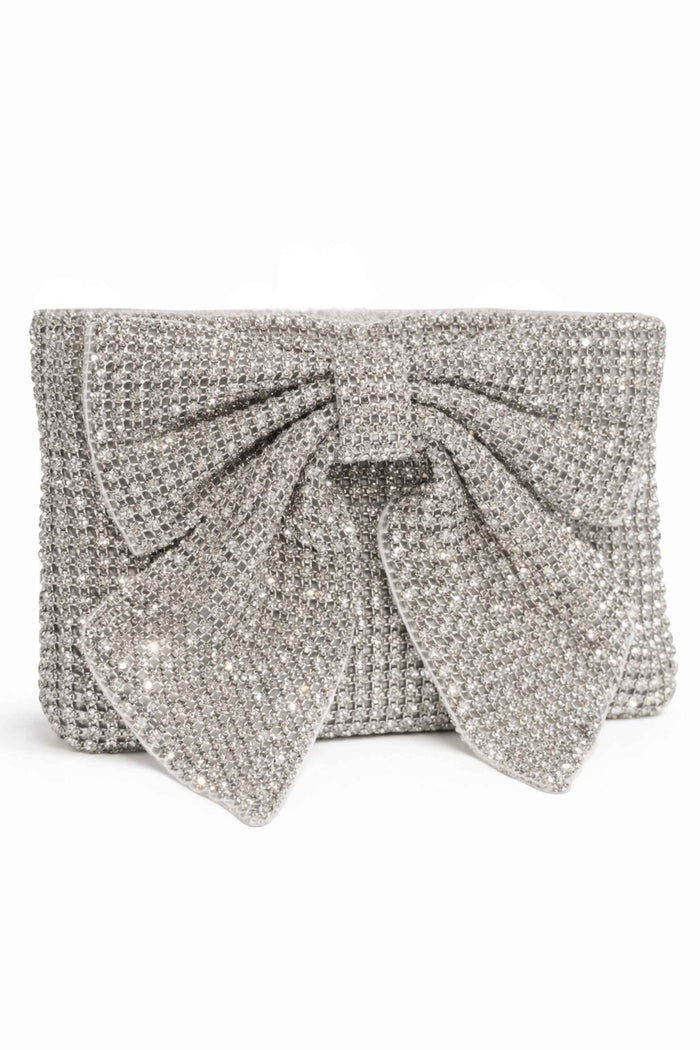 Silver beaded clutch bag with a structured rectangular shape and a large decorative bow on the front, covered in shimmering silver beads for elegant evening wear.