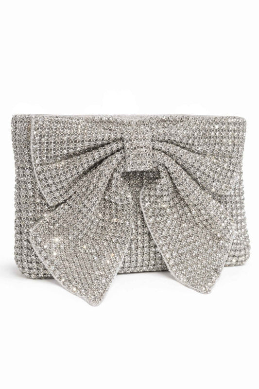 Silver beaded clutch bag with a structured rectangular shape and a large decorative bow on the front, covered in shimmering silver beads for elegant evening wear.