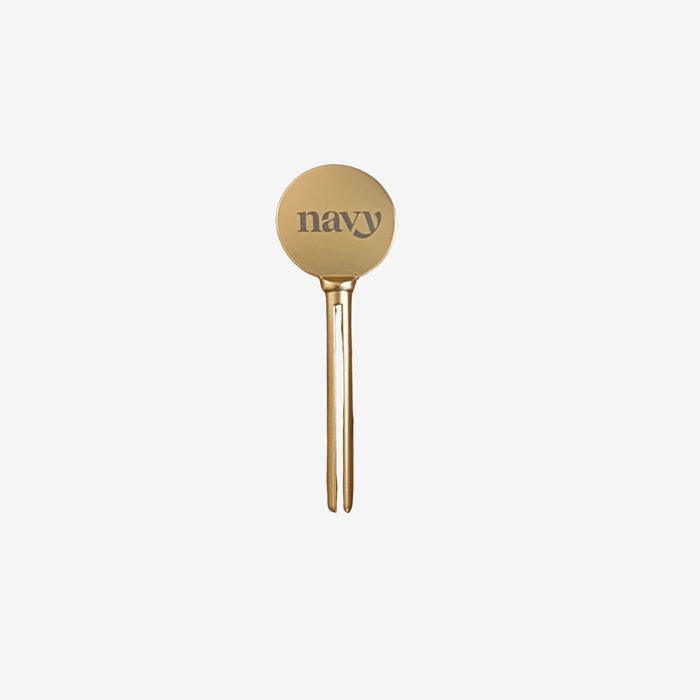 Gold paddle with 'navy' text on a white background