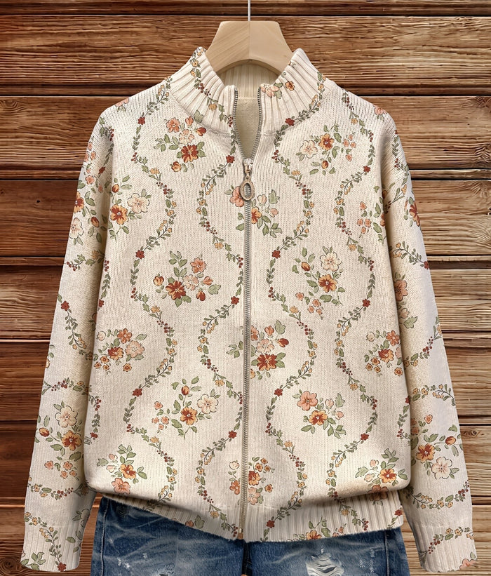 Cream zip-front cardigan with a delicate floral vine print in peach, rust, and sage