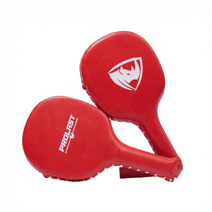 PROLAST boxing paddles in red, pair with a white rhino shield logo on one and PROLAST lettering on the other