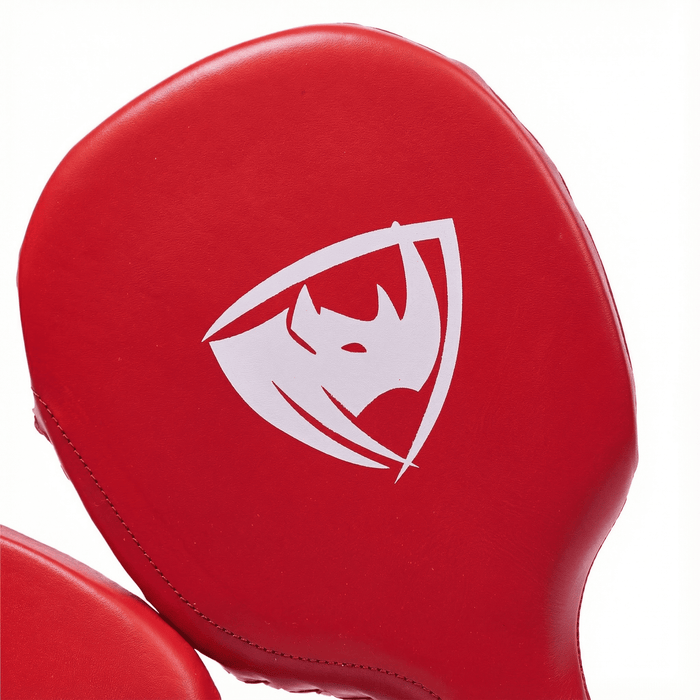 PROLAST boxing paddles in red, close-up of the paddle face with the white rhino shield logo
