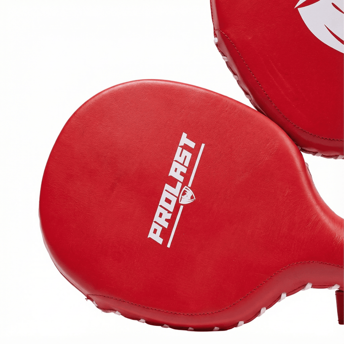 PROLAST boxing paddles in red, close-up of the white PROLAST lettering and white edge stitching