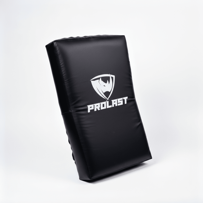 PROLAST kick shield in black standing at an angle, showing the logo side and its thickness