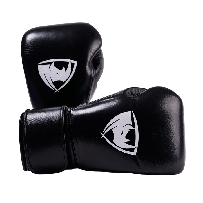 PROLAST PG professional boxing gloves in charcoal black with Velcro strap, stacked pair with both white rhino logos showing