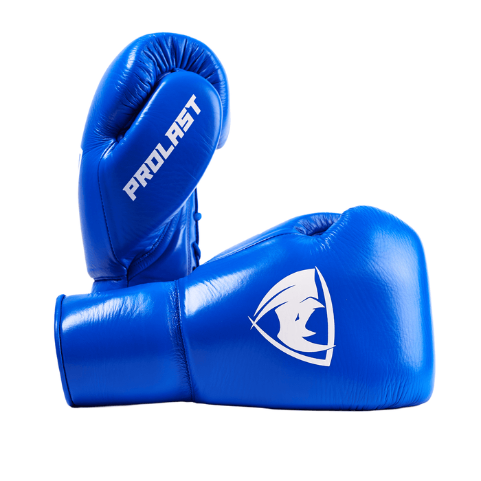PROLAST PG professional lace-up boxing gloves in cobalt blue, one upright side-on, one lying with white rhino logo