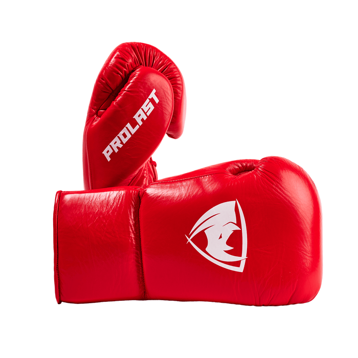 PROLAST PG professional lace-up boxing gloves in crimson red, one upright side-on, one lying with white rhino logo